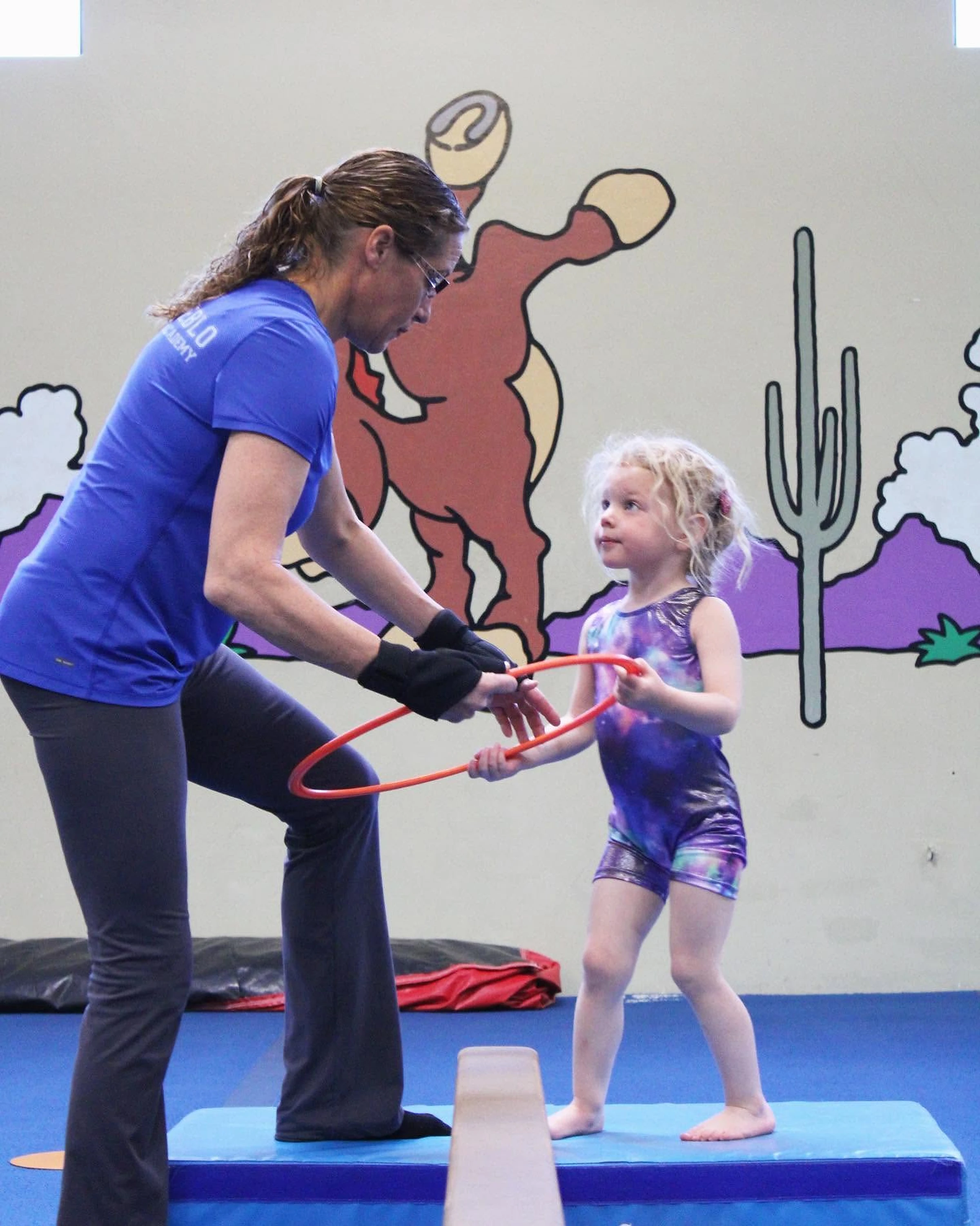 Preschoolers climbing soft shapes